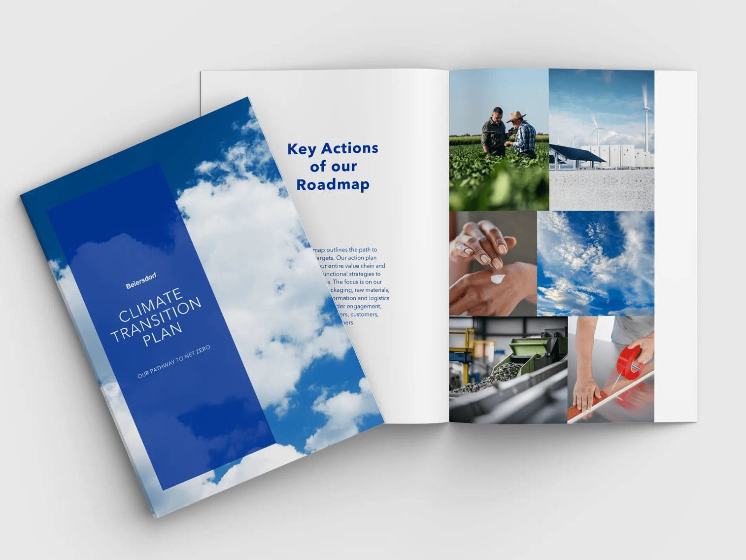 Aufgeschlagenes Buch mit dem Titel Climate Transition Plan auf grauem Hintergrund.