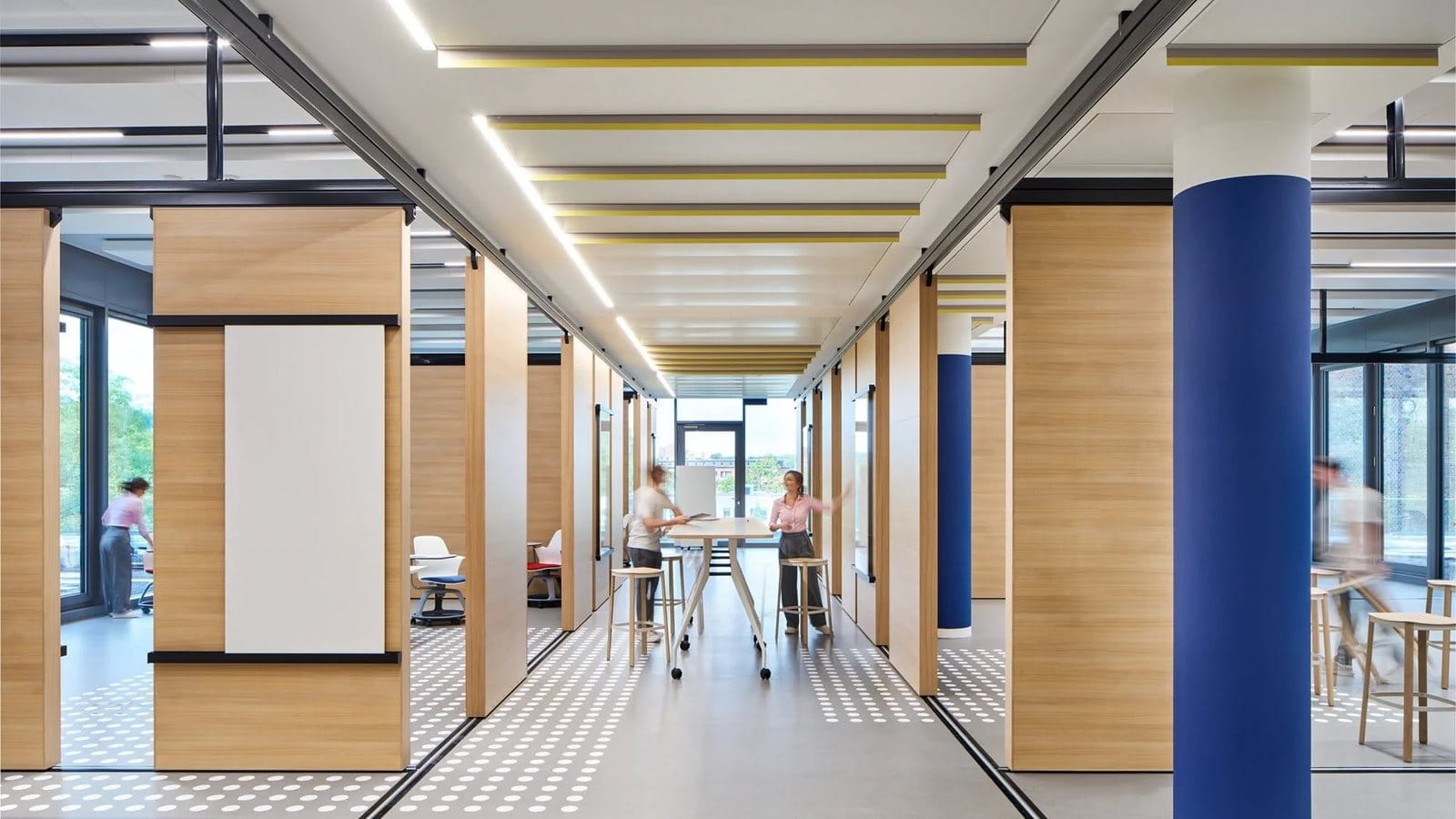 A corporate presentation slide titled "Beiersdorf at a Glance" features a dark blue summary bar and a business segment breakdown. The summary bar notes the company was founded in 1882, has 17,398 employees, reached €6,285 million in Group Sales for 2014, and is listed on the DAX. A central donut chart labeled "Business Segments" illustrates the division between the "Consumer" and "tesa" segments. The Consumer quadrant highlights three global brands—NIVEA (+6.2%), Eucerin (+6.0%), and La Prairie (+5.1%)—noting significant market share gains in 2014. The tesa quadrant details strong 2014 development, noting that B2B accounts for 74% of sales across electronics, automotive, print, and paper industries, while B2C contributes 26% through the office and DIY sectors.